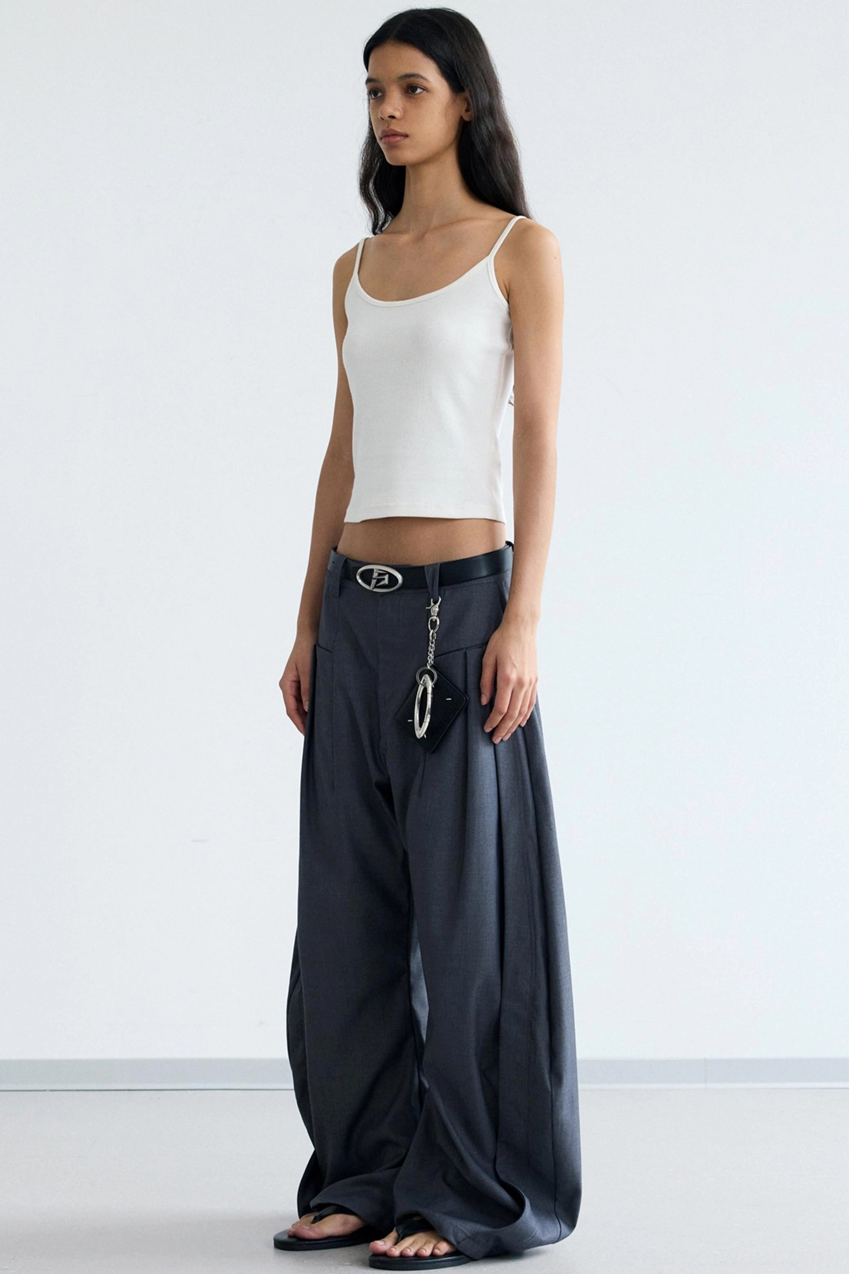 Women's minimalist ribbed cropped camisole streetwear tank top close-up showing fitted cropped design