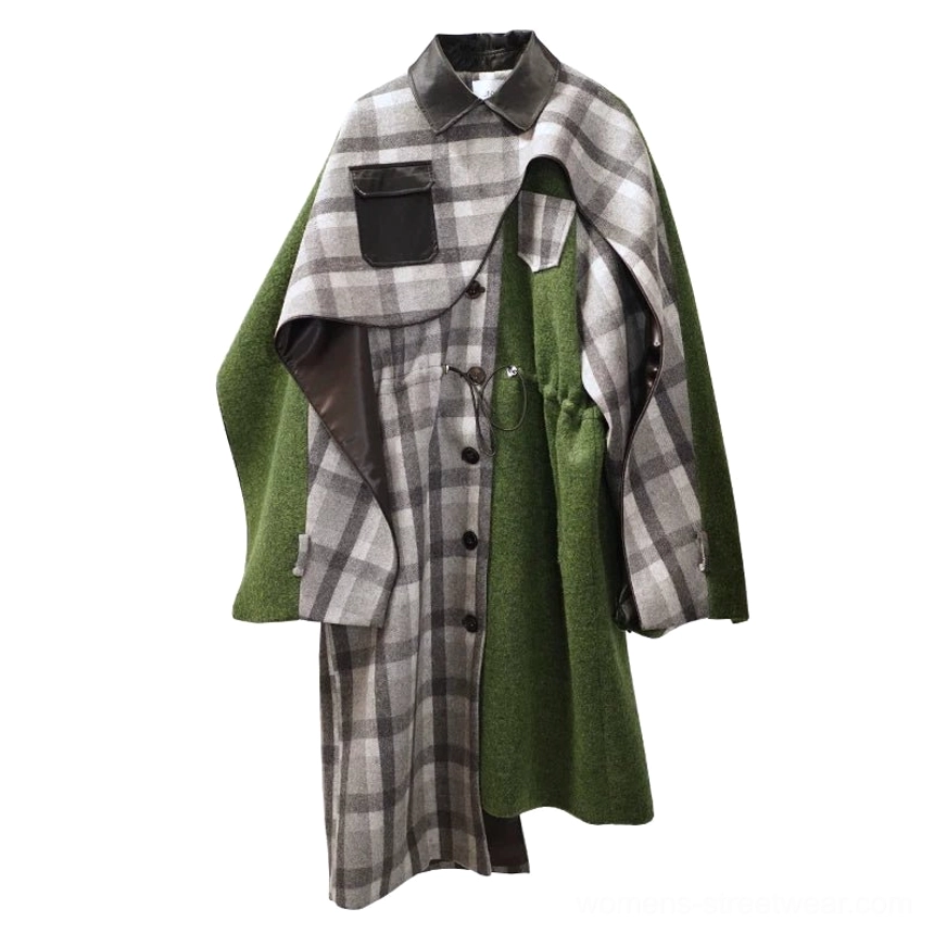 Flat lay of women's moss green asymmetric plaid cape coat on a white background featuring detachable overlay, faux leather pocket, black collar, and drawstring waist
