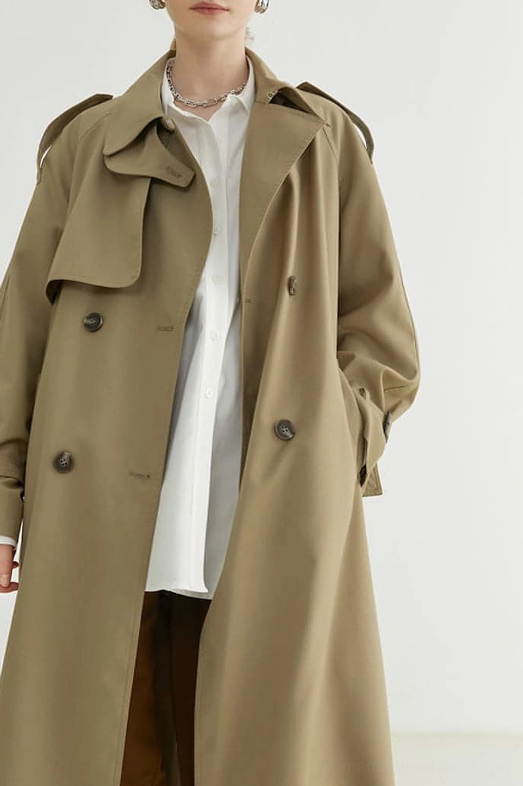 Close three-quarter view of women's oversized khaki double-breasted melton trench coat lapel and pockets