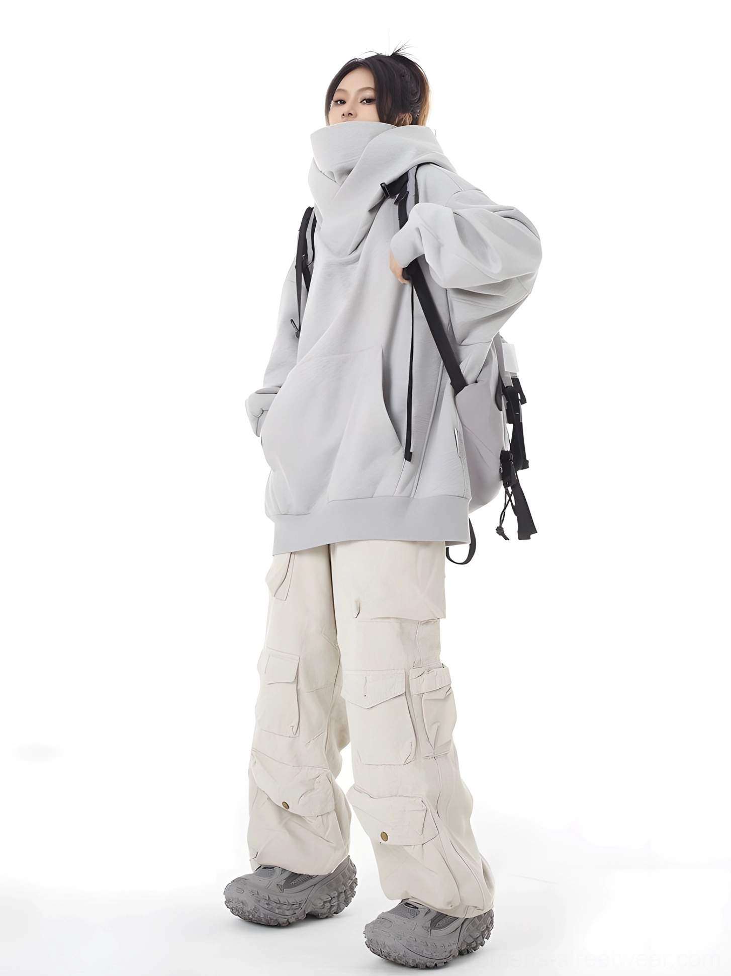 Women's oversized high-neck hooded pullover showcasing relaxed drop shoulder streetwear proportions and modern hood design