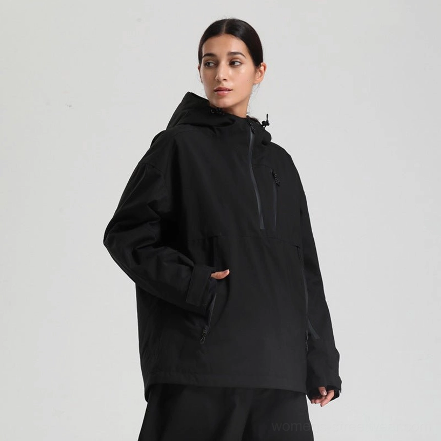 Women’s oversized black waterproof ski anorak jacket with hood and half zip pullover design side front view