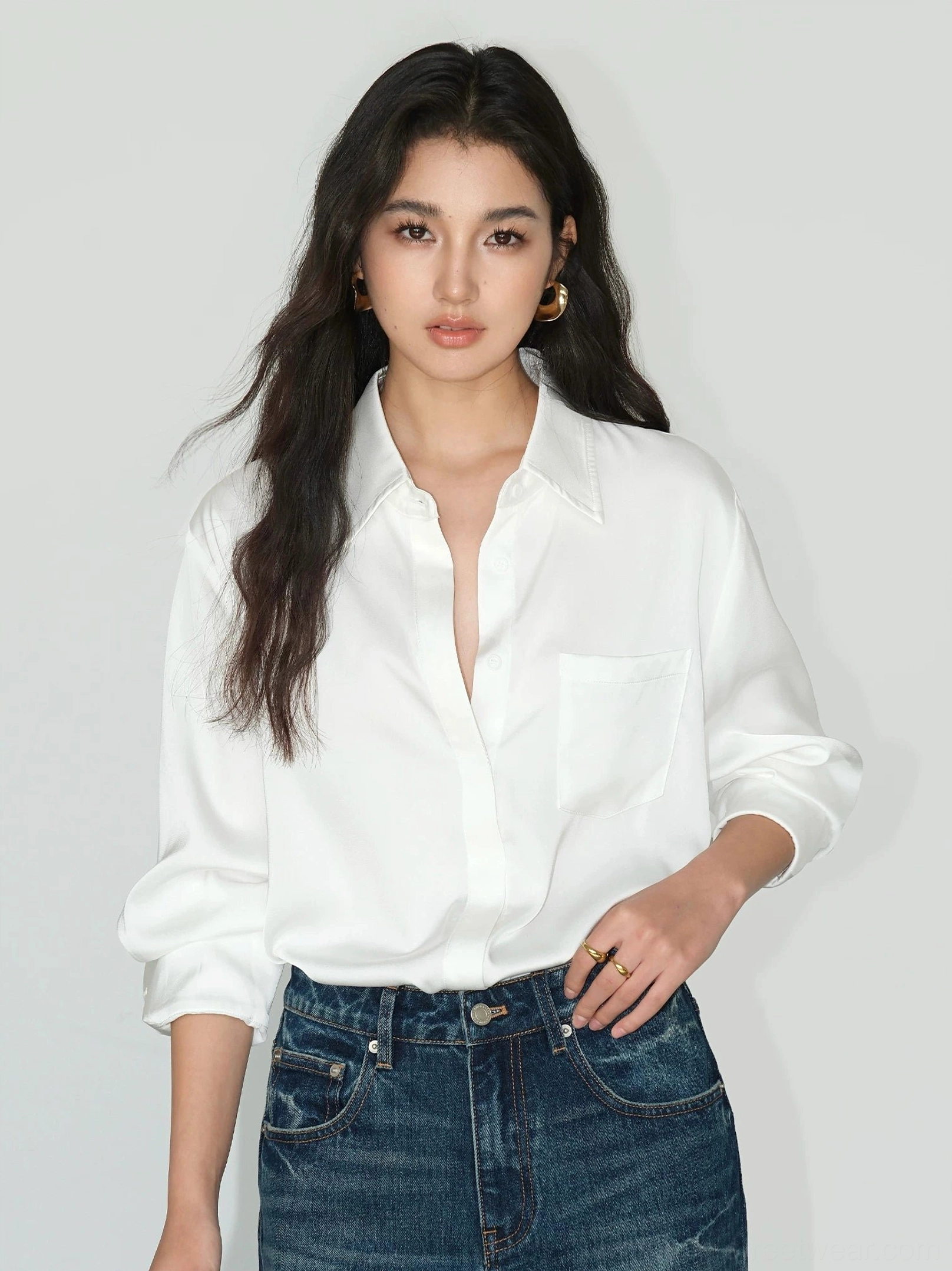 Pearl white Korean streetwear button up shirt with classic collar chest pocket and relaxed fit styled with denim jeans