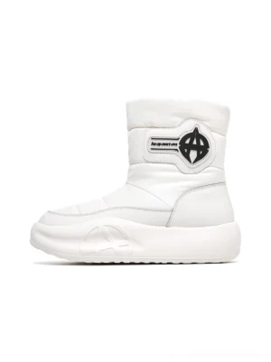 White women's quilted padded mid-calf platform snow boot side profile with black logo ankle strap and chunky sculpted sole