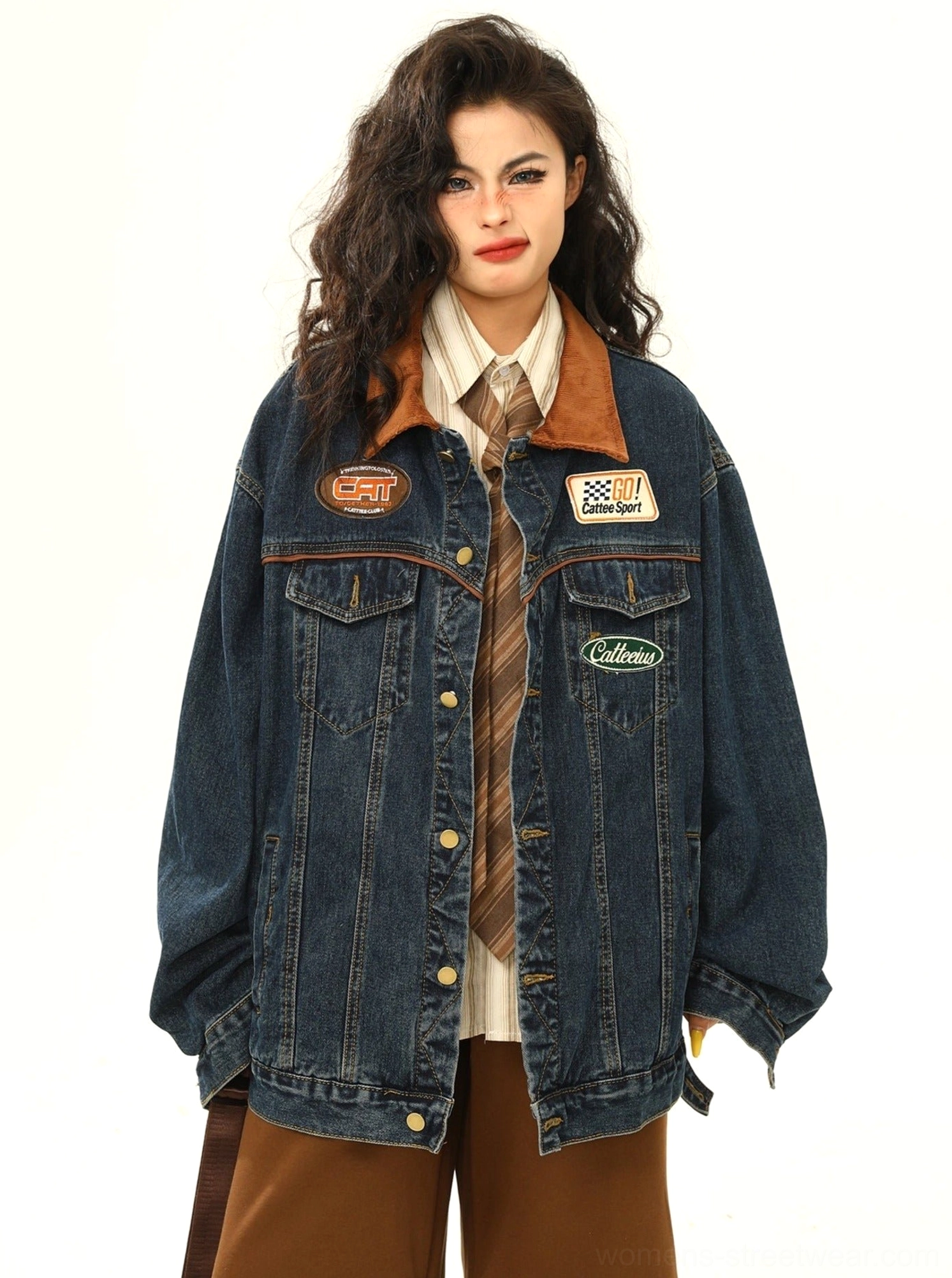 Front view of women's dark blue racing patch denim jacket with contrasting corduroy collar and button-down streetwear design