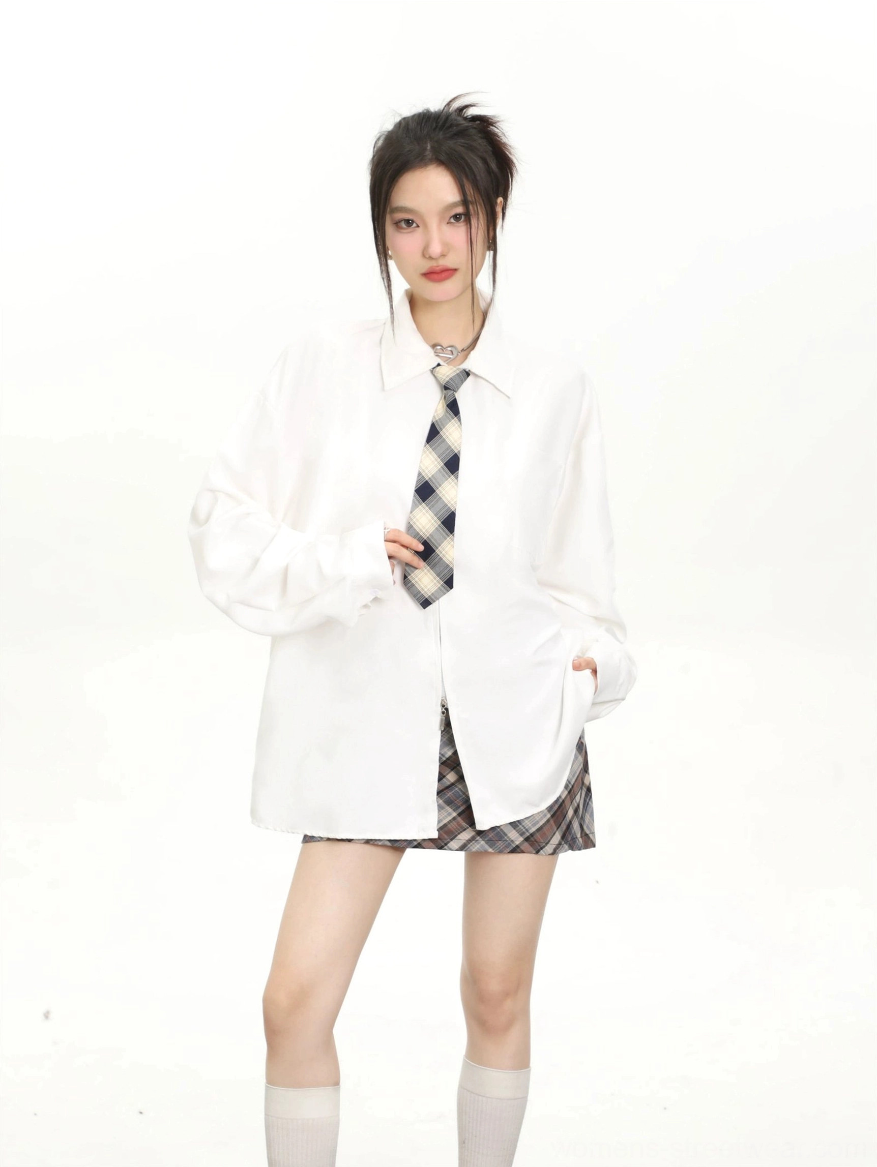 White oversized retro tie long sleeve shirt for women styled with a plaid mini skirt, socks, and loafers
