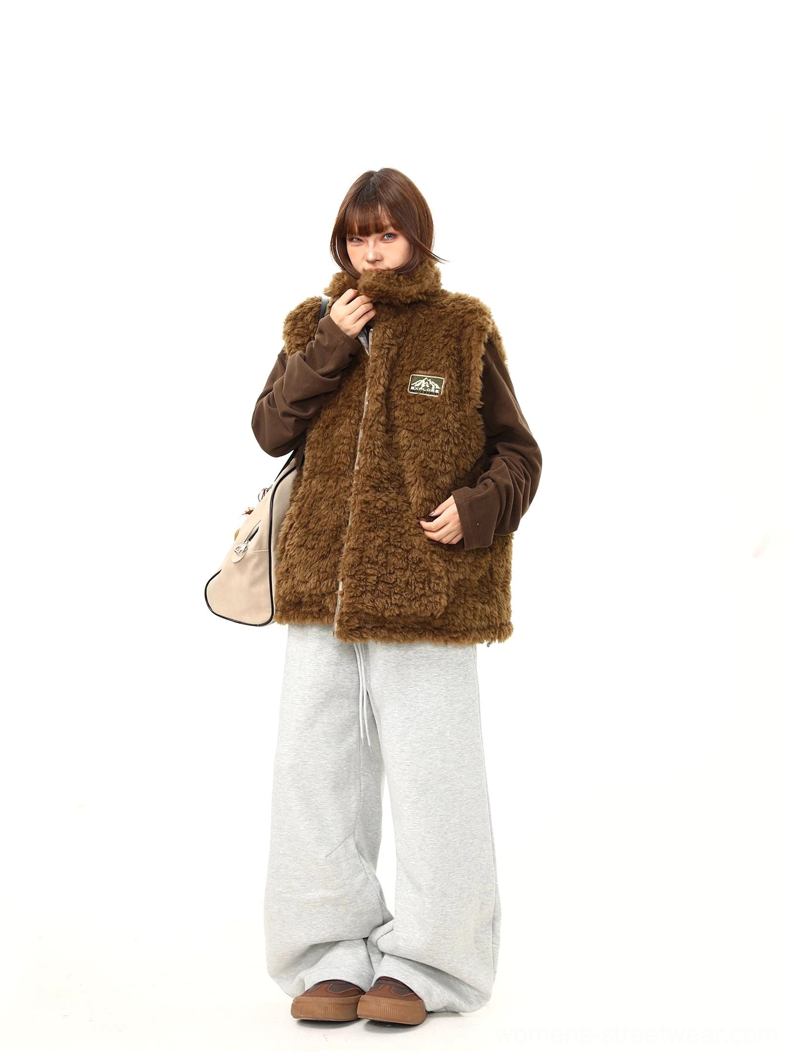 Women's reversible plaid sherpa vest with teddy fleece lining and quilted check outerwear design detail