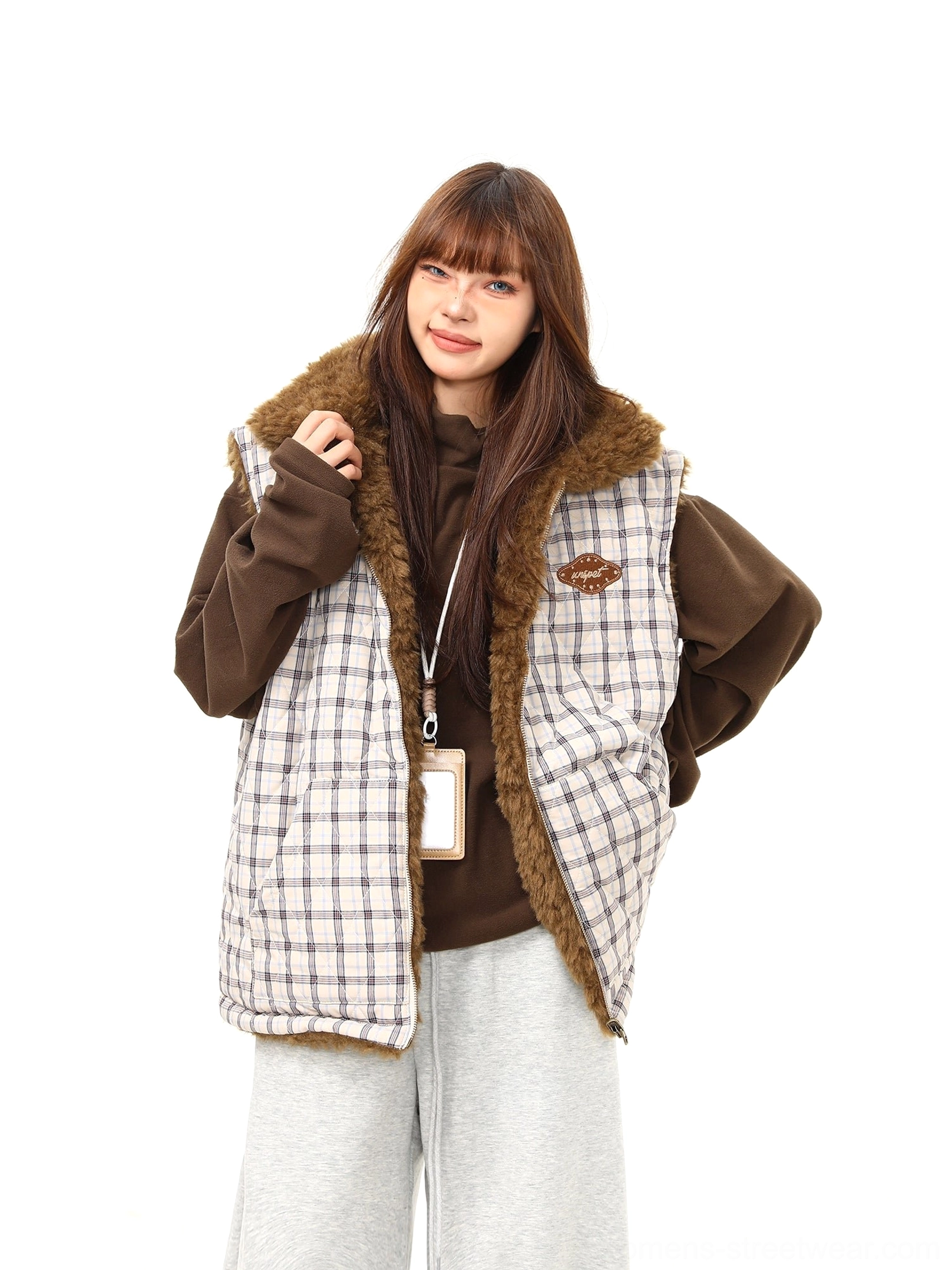 Women's reversible plaid sherpa vest featuring a warm teddy fleece texture and relaxed streetwear silhouette