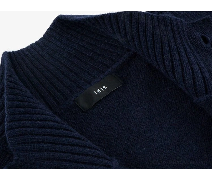 Inner ribbed stand collar and soft wool knit texture detail on women's dark blue cocoon cardigan