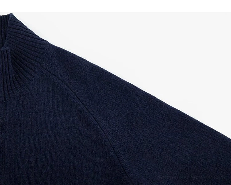 Ribbed stand collar and raglan shoulder detail on dark blue women's wool cocoon cardigan