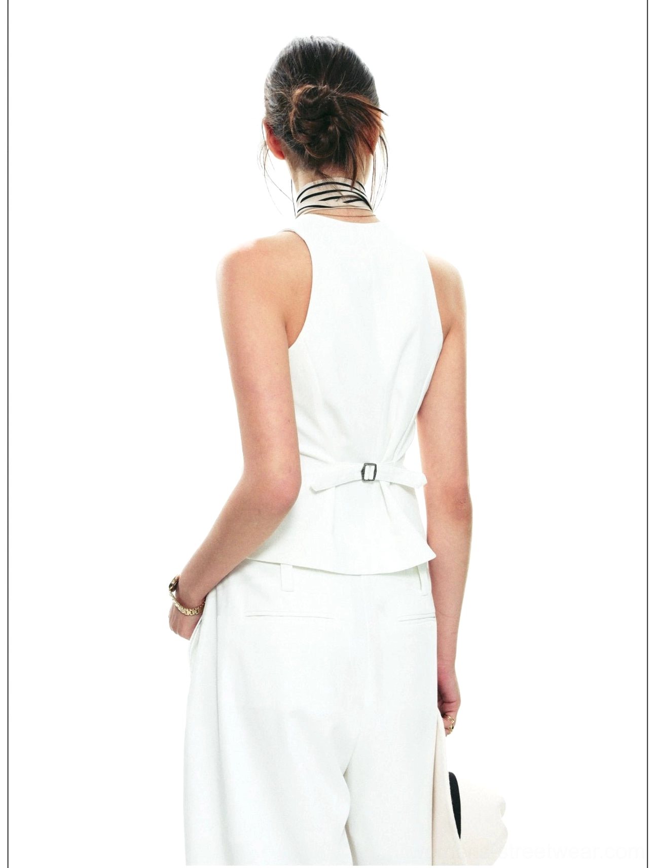 Women's structured halter waistcoat and flowing wide-leg trouser set for resort, travel, and city styling
