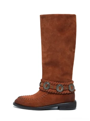 Chestnut brown suede-textured western knee-high riding boot with metal buckle strap, moc-toe stitching, pointed toe, and low block heel