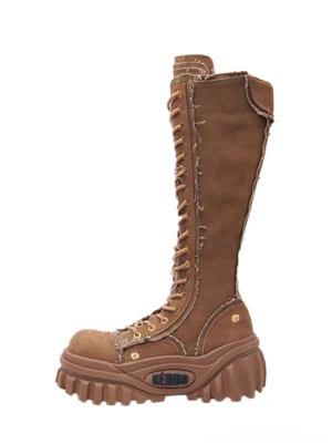 Brown women’s tall lace-up platform riding boots with frayed canvas trim shown in front three-quarter product view