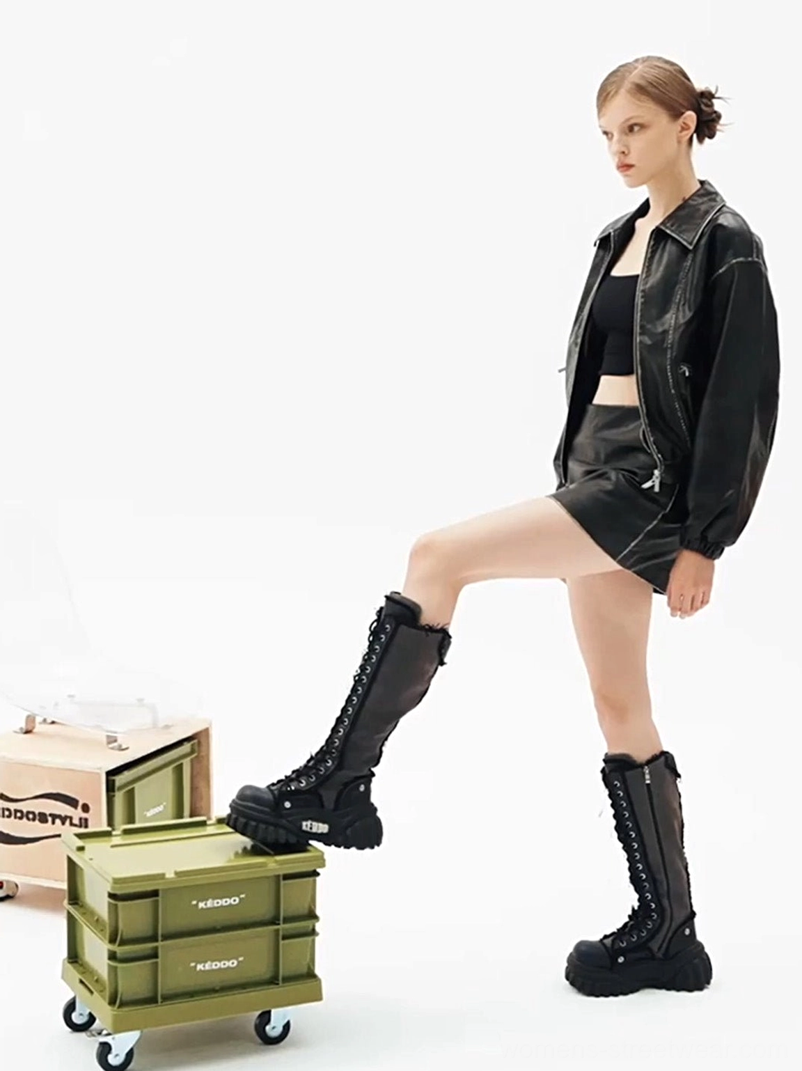 Women’s tall lace-up platform riding boots side detail showing front lacing and structured riding boot shaft