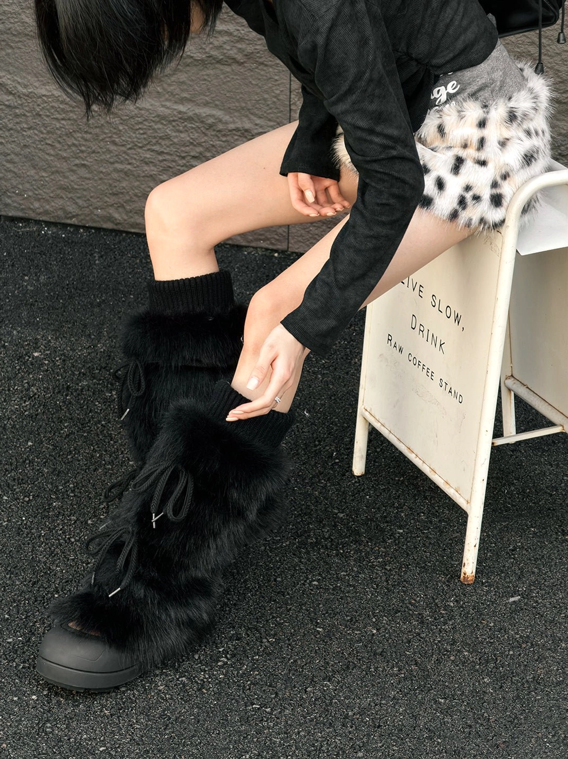 Women's tall platform boots in black and white with cozy plush lining detail