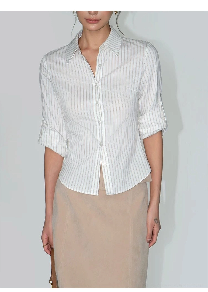 Full-body women's three-quarter rolled-sleeve striped shirt styled with a beige midi skirt in minimalist Korean streetwear fashion