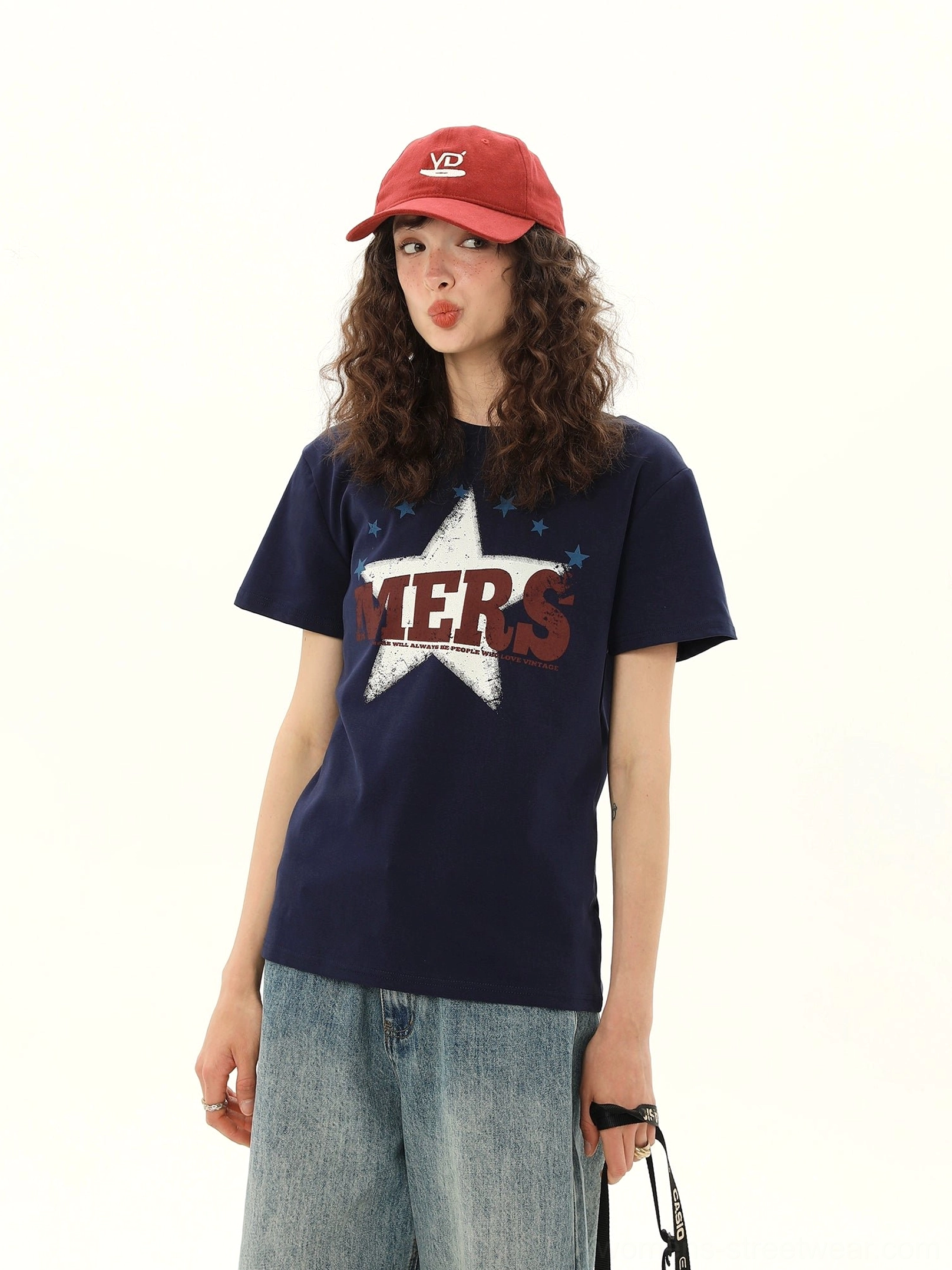 Women's dark blue MERS star graphic crewneck T-shirt shown from the front with casual denim streetwear styling
