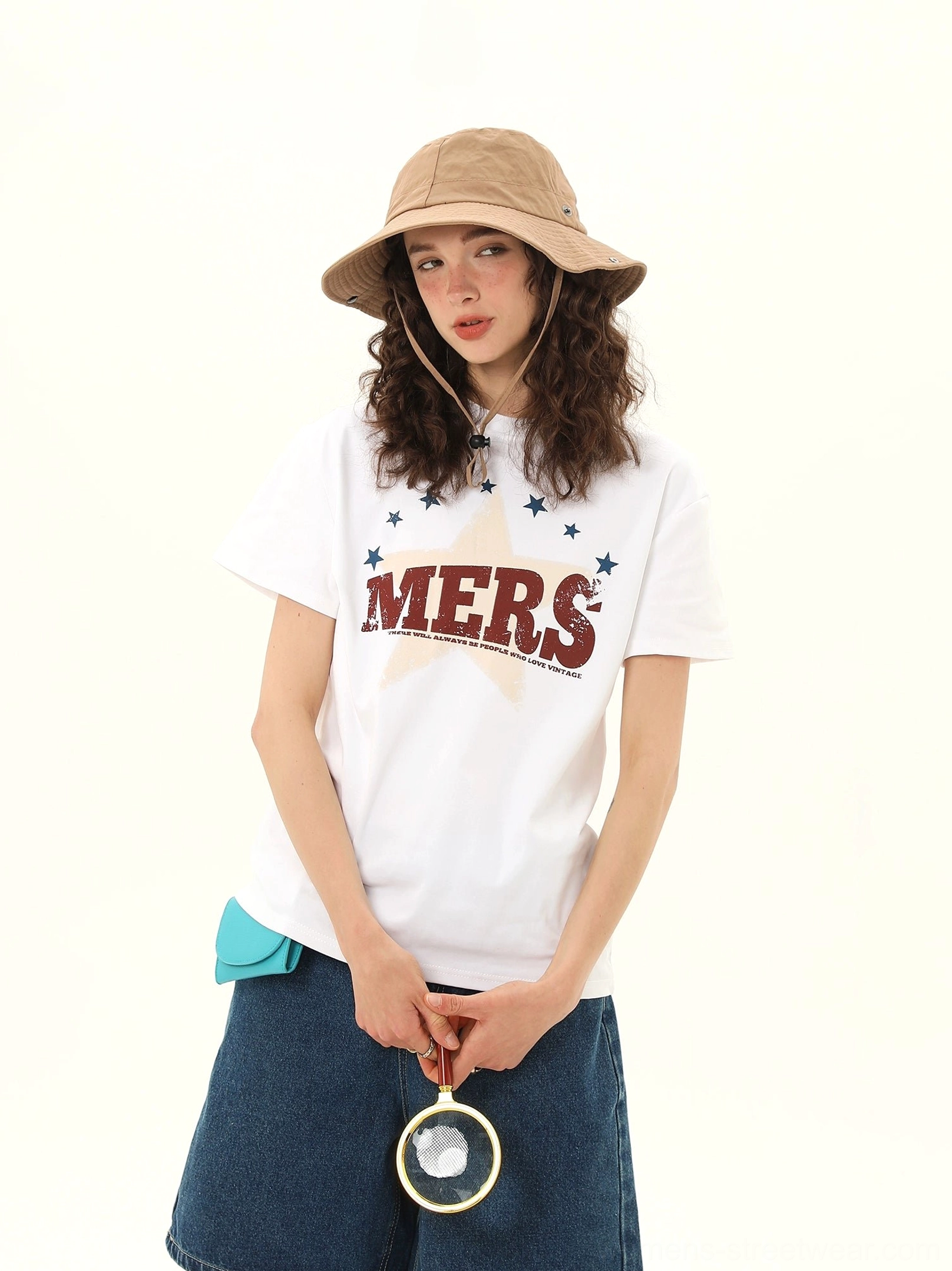 Women's vintage MERS star varsity graphic tee showing distressed lettering and oversized star print detail