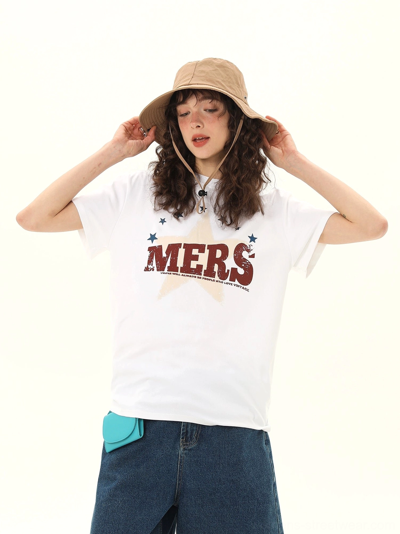 Three quarter view of women's white vintage MERS star varsity graphic T-shirt with crewneck and short sleeves