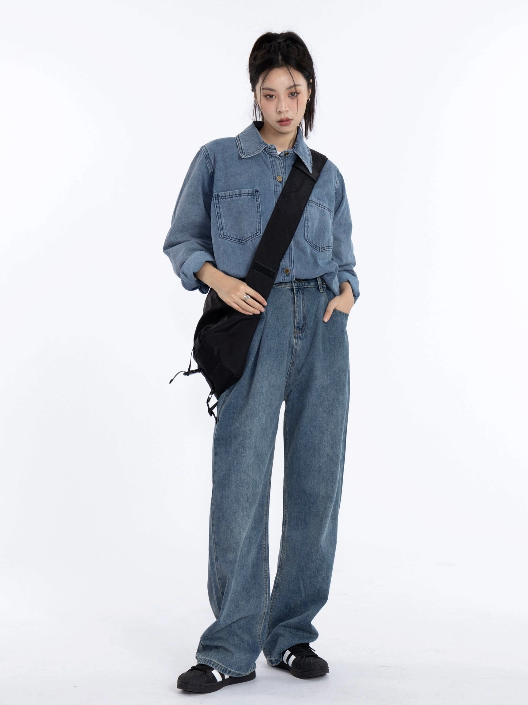 Women's vintage washed blue denim shirt jacket worn with matching wide-leg jeans for a casual Korean streetwear outfit