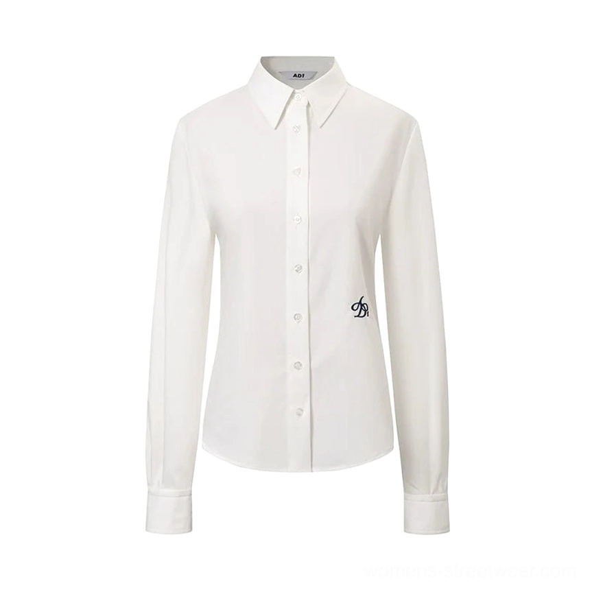 Classic white women's Korean preppy button down shirt front flat lay with pointed collar and embroidered hem accent