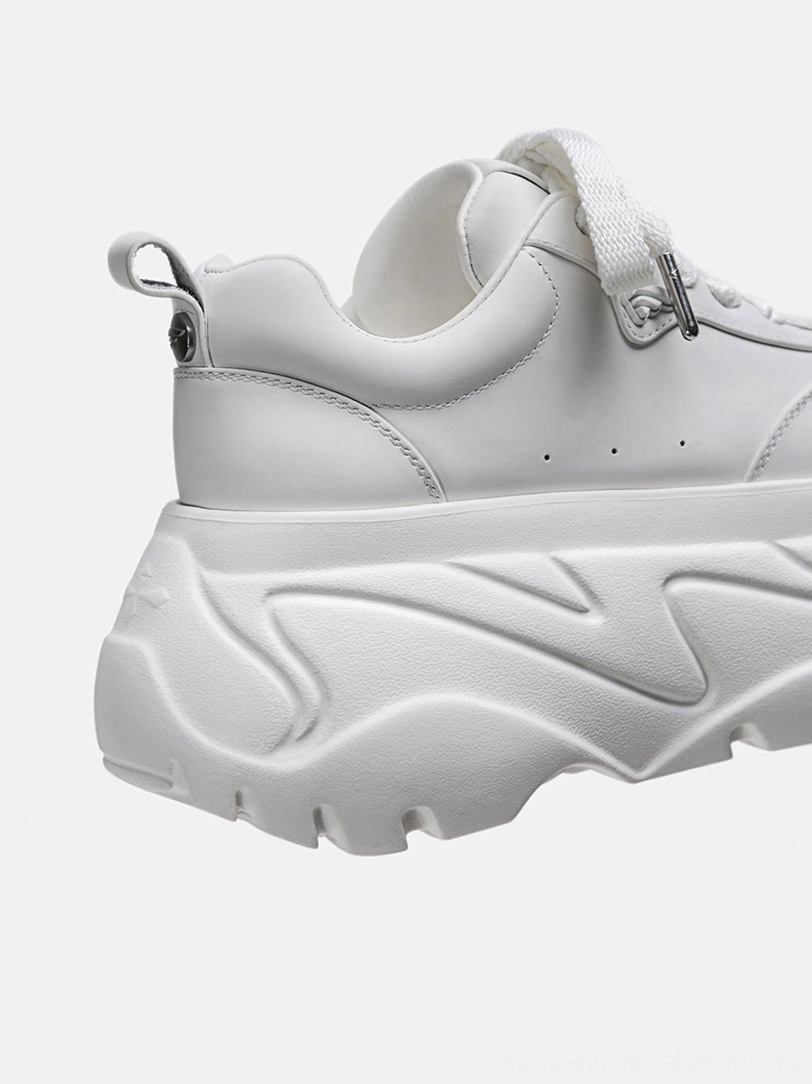Women's white platform sneakers product image highlighting the polished leather-look finish and elevated urban fashion design