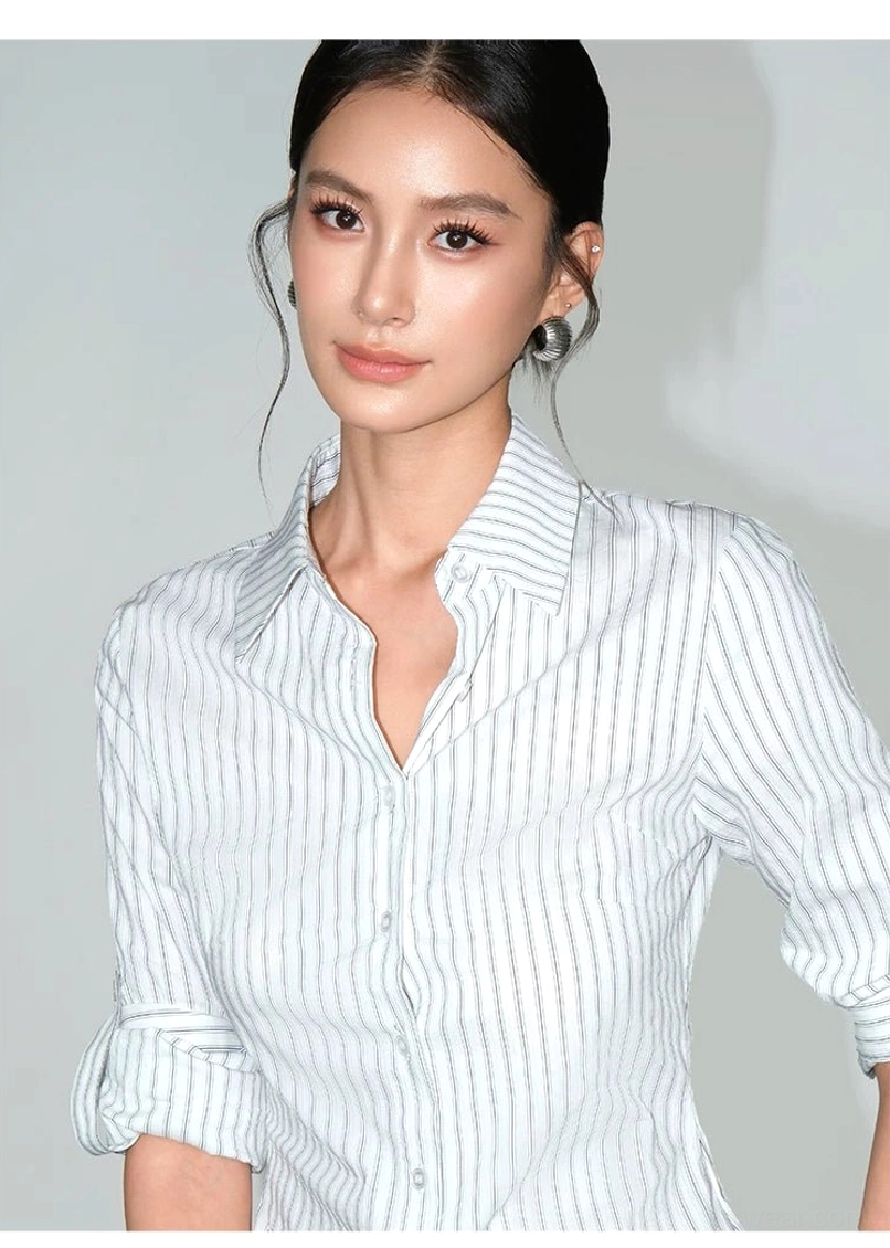 Women's white striped button-up shirt with slim tailored silhouette and versatile smart-casual styling