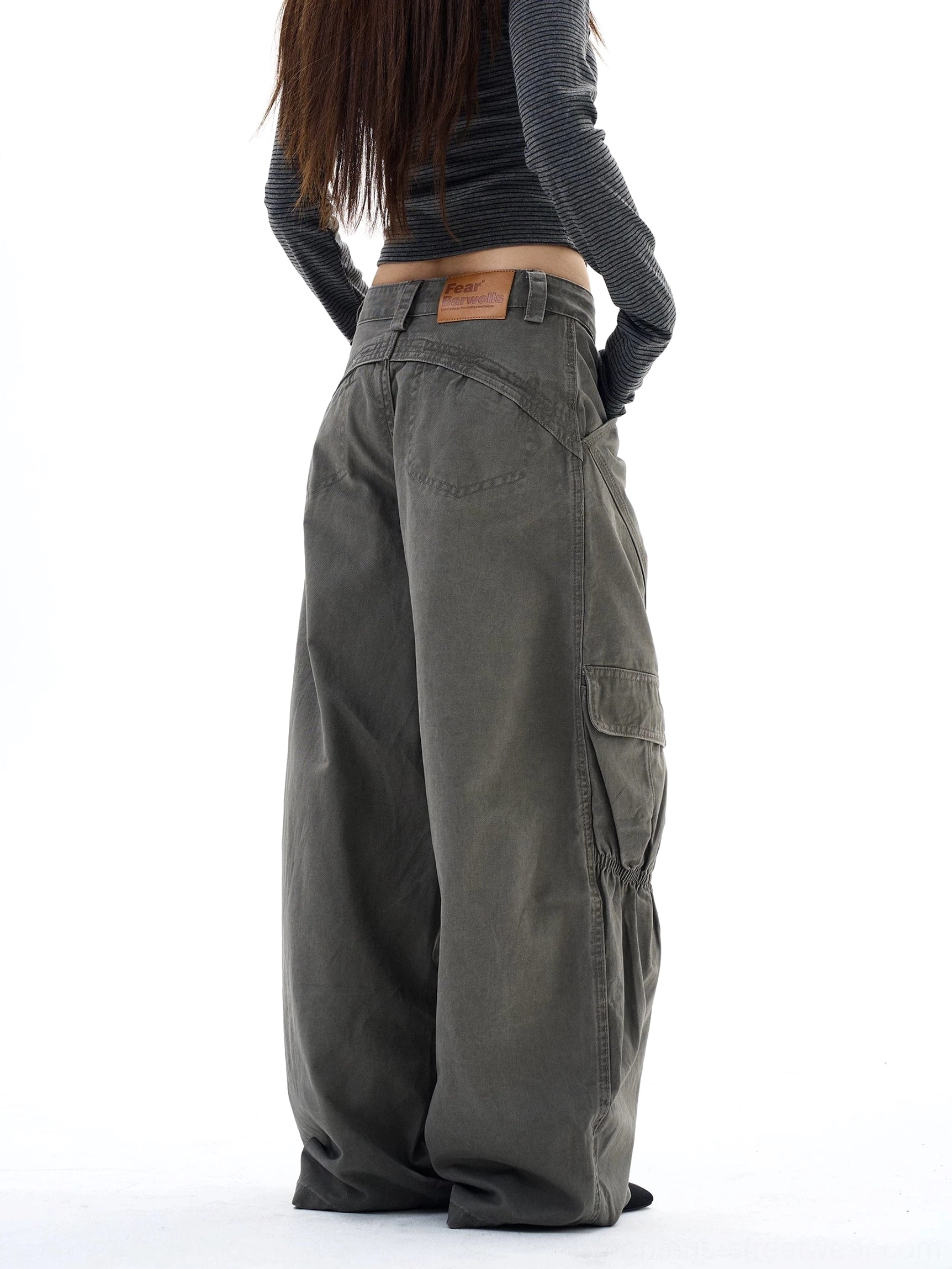 Full rear view of women's wide-leg cargo pants with a consistent washed olive-gray finish and discreet back pocket detailing