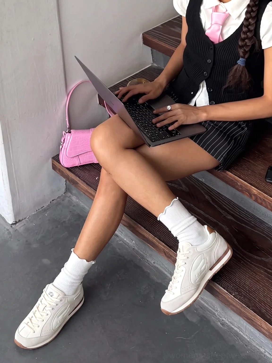 Women's gray white wing panel retro court sneakers styled with white socks in a casual preppy streetwear outfit