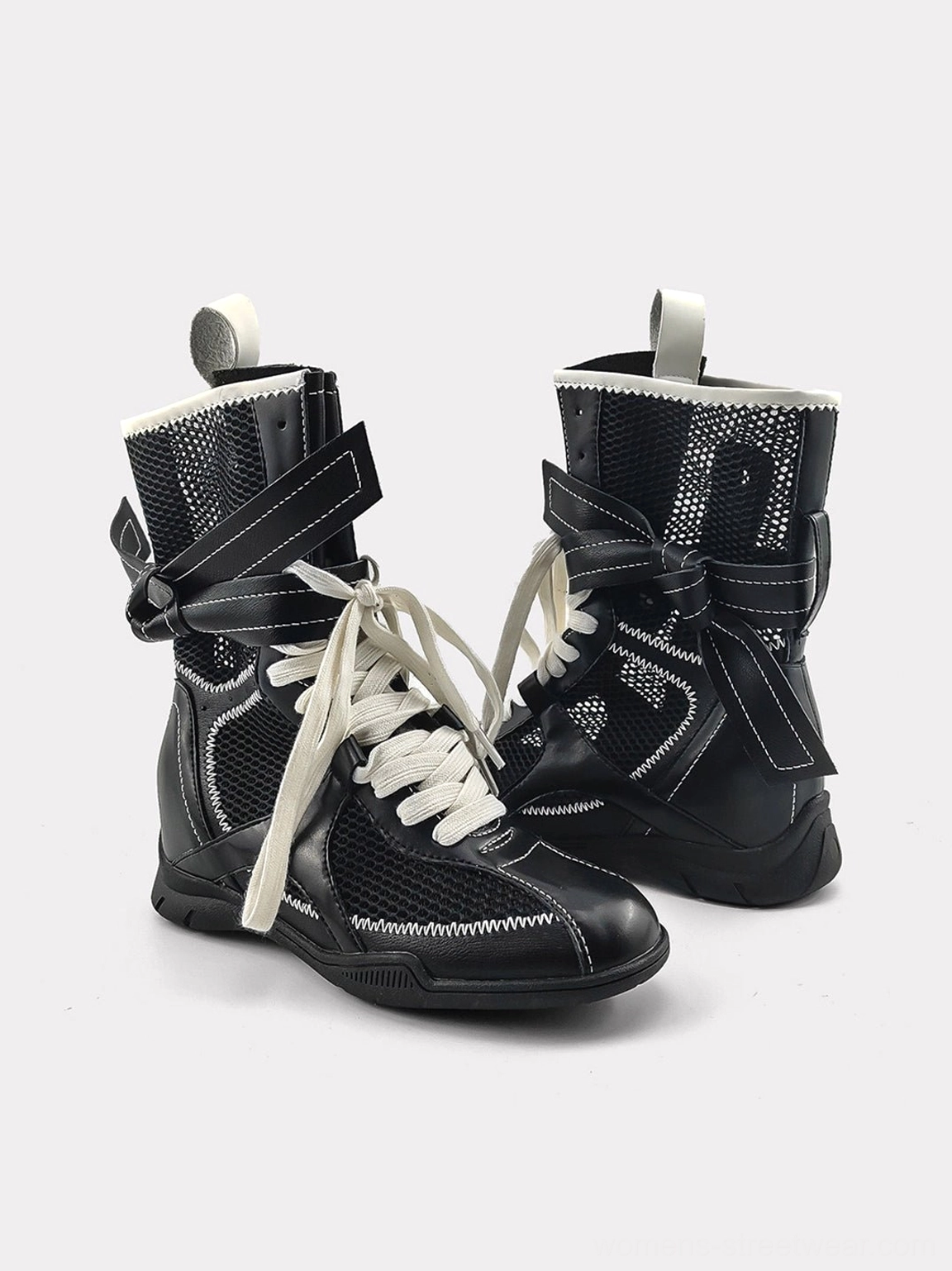 Women's bow detail lace-up mid-calf boots featuring ventilated mesh-look panels, microfiber lining, and a technical streetwear sole