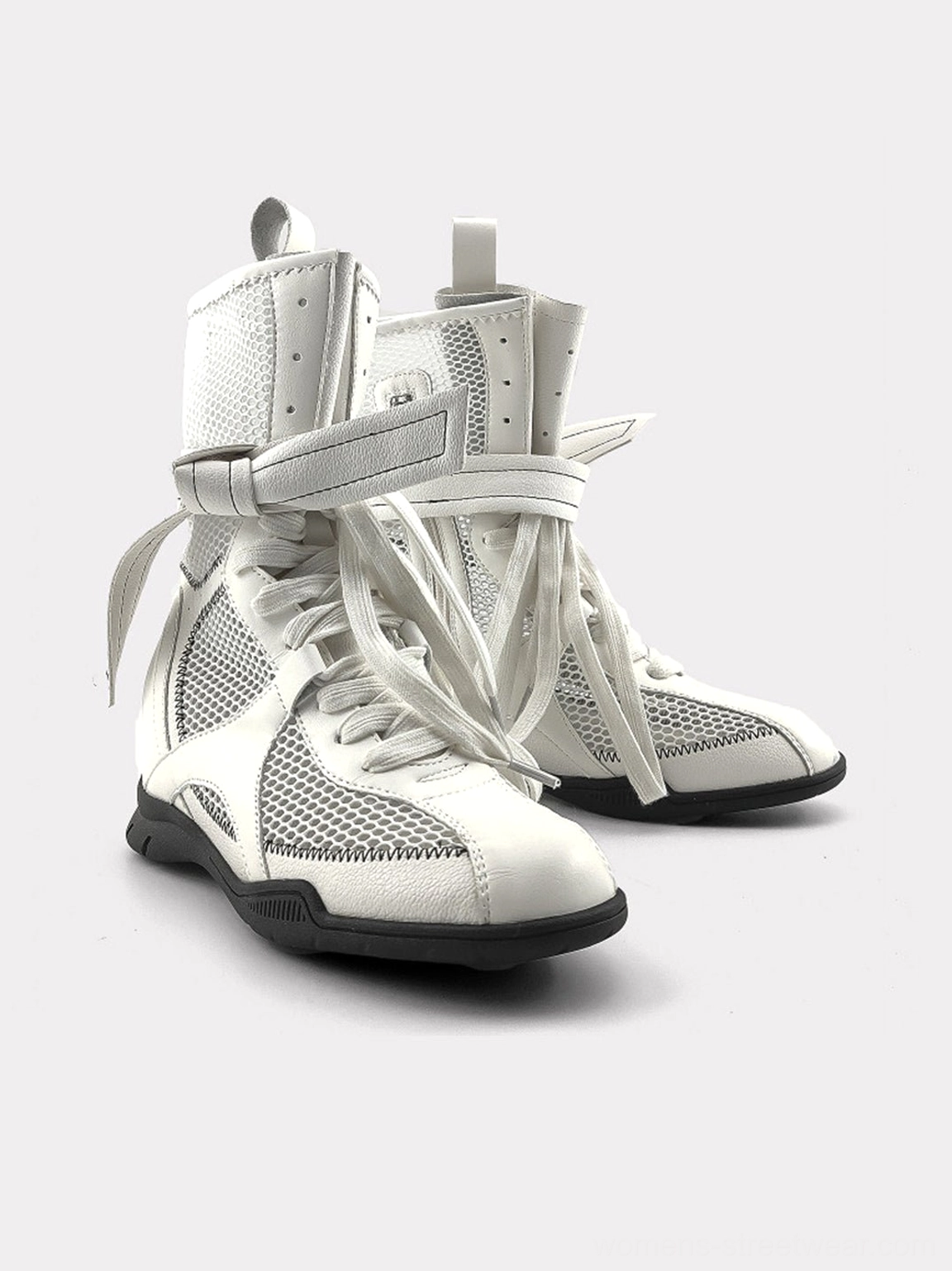 Pair of white mesh mid-calf streetwear sport boots featuring oversized ankle bows, front lacing, and a technical rubber outsole