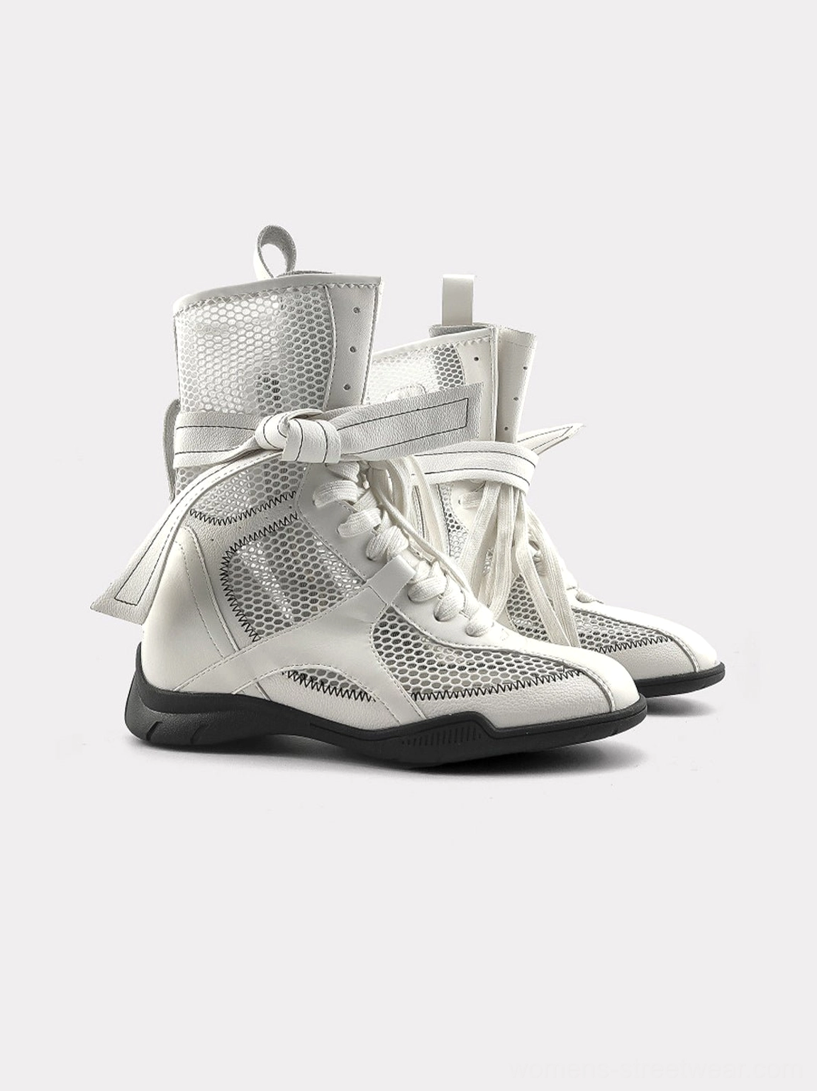 White women's mid-calf mesh sport boot pair shown from the front side angle highlighting the full lace-up design and athletic silhouette