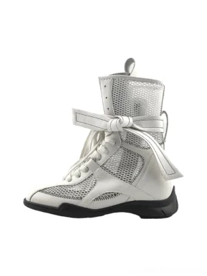 White women's bow lace-up mesh mid-calf sport boot shown in a left profile three-quarter studio view with leather trims, ankle bow strap, and black rubber outsole