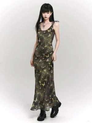 Women's woodland butterfly camo sheer slip maxi dress shown in a full front view with black combat boots
