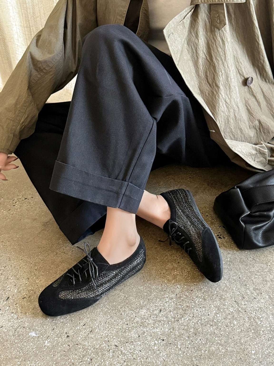 Woven leather German trainer sneakers featuring a low-top lace-up silhouette, textured leather panels, rounded toe, and contemporary streetwear styling
