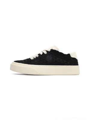 Black woven platform sneakers with braided texture upper, off-white rubber sole, and flat contrast laces side profile