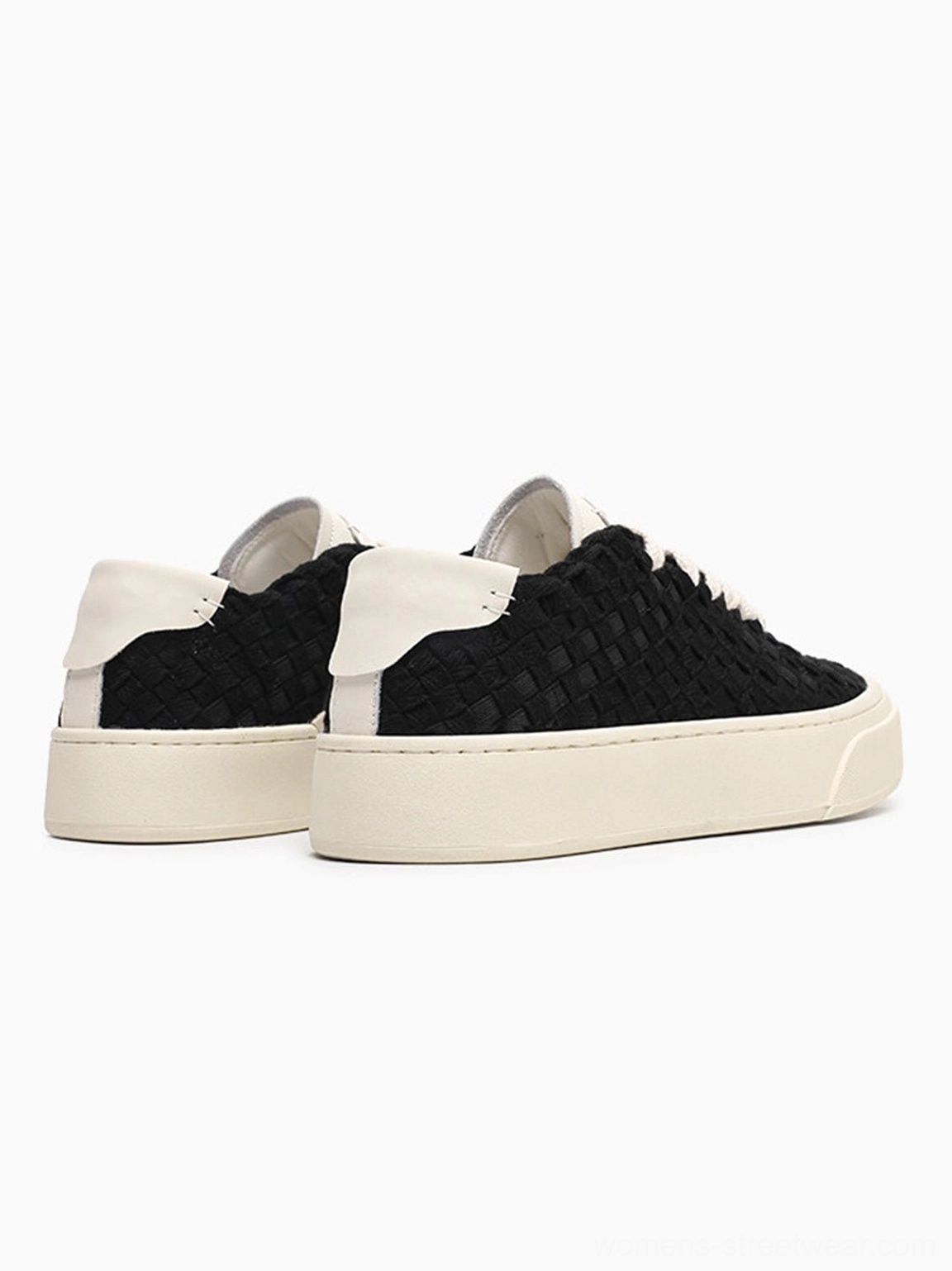 Rear view of black woven platform sneakers with heel pull tabs and off-white rubber soles