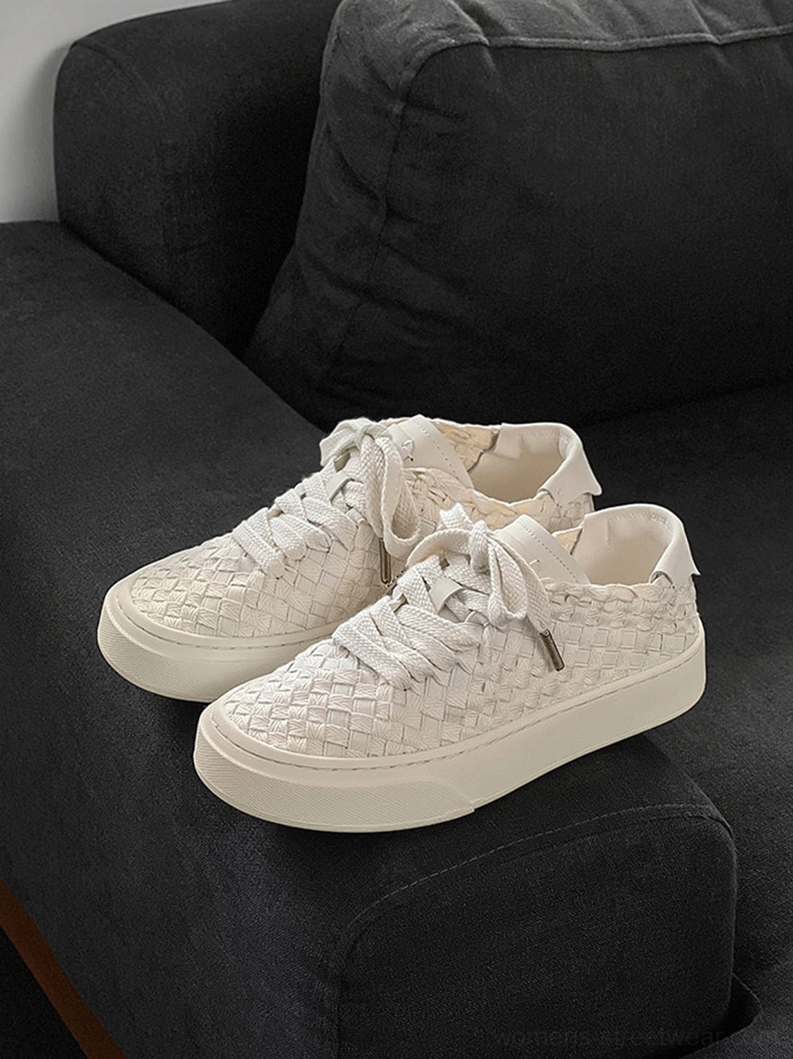 Woven platform sneakers clean product image featuring elevated rubber sole and woven surface texture