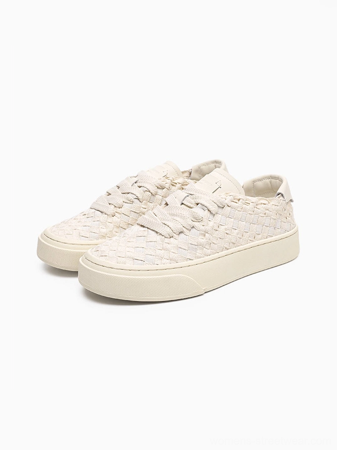 Woven platform sneakers detailed view of thick contrast sole and textured casual upper