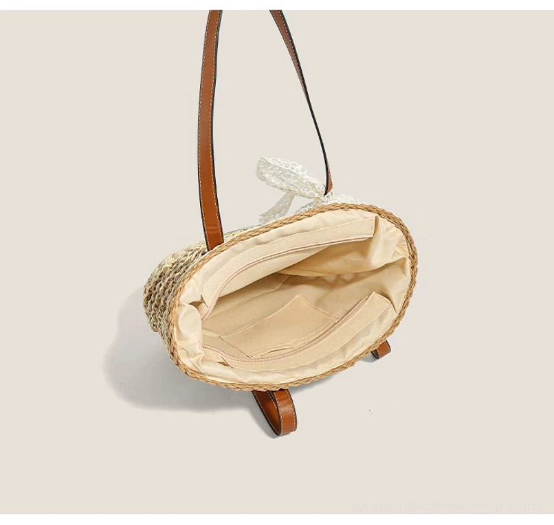 Interior view of a woven straw basket tote with beige polyester lining, main compartment, and inner zip pocket