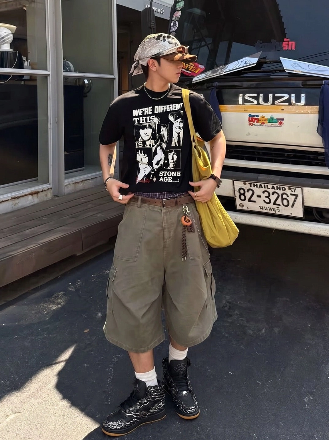 Full streetwear look with black and silver Wukong cloud relief high-top sneakers and yellow shoulder bag