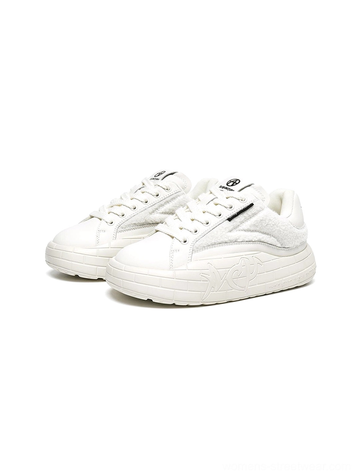 Y2K-inspired black fleece platform sneakers with tactile texture and modern low-top construction