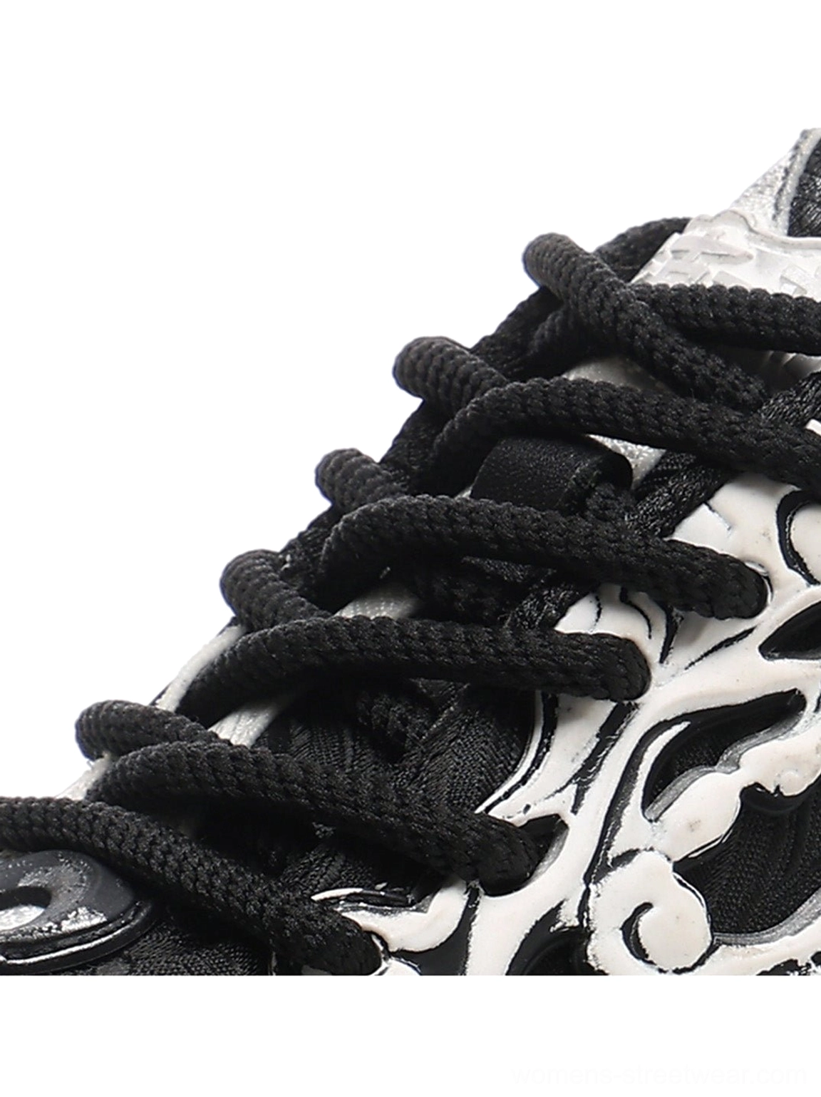 Y2K black and white chunky platform sneakers with expressive flame skull graphics and lace-up streetwear construction
