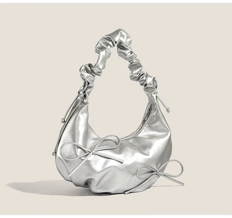Metallic silver Y2K bow ruched hobo shoulder bag front three quarter view with scrunchie strap