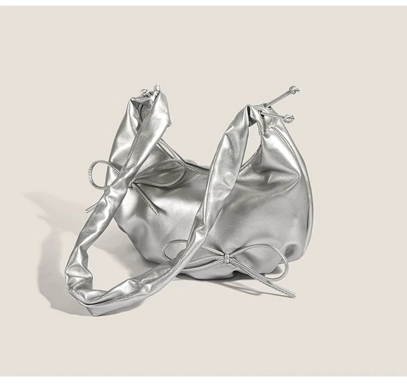 Side and rear view of metallic silver bow ruched hobo shoulder bag with smooth faux leather finish