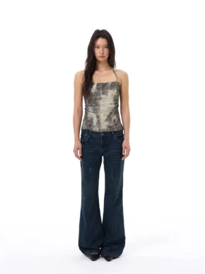 Full front view of a slim desert mirage print camisole top with square neckline and thin straps styled with blue wide-leg jeans