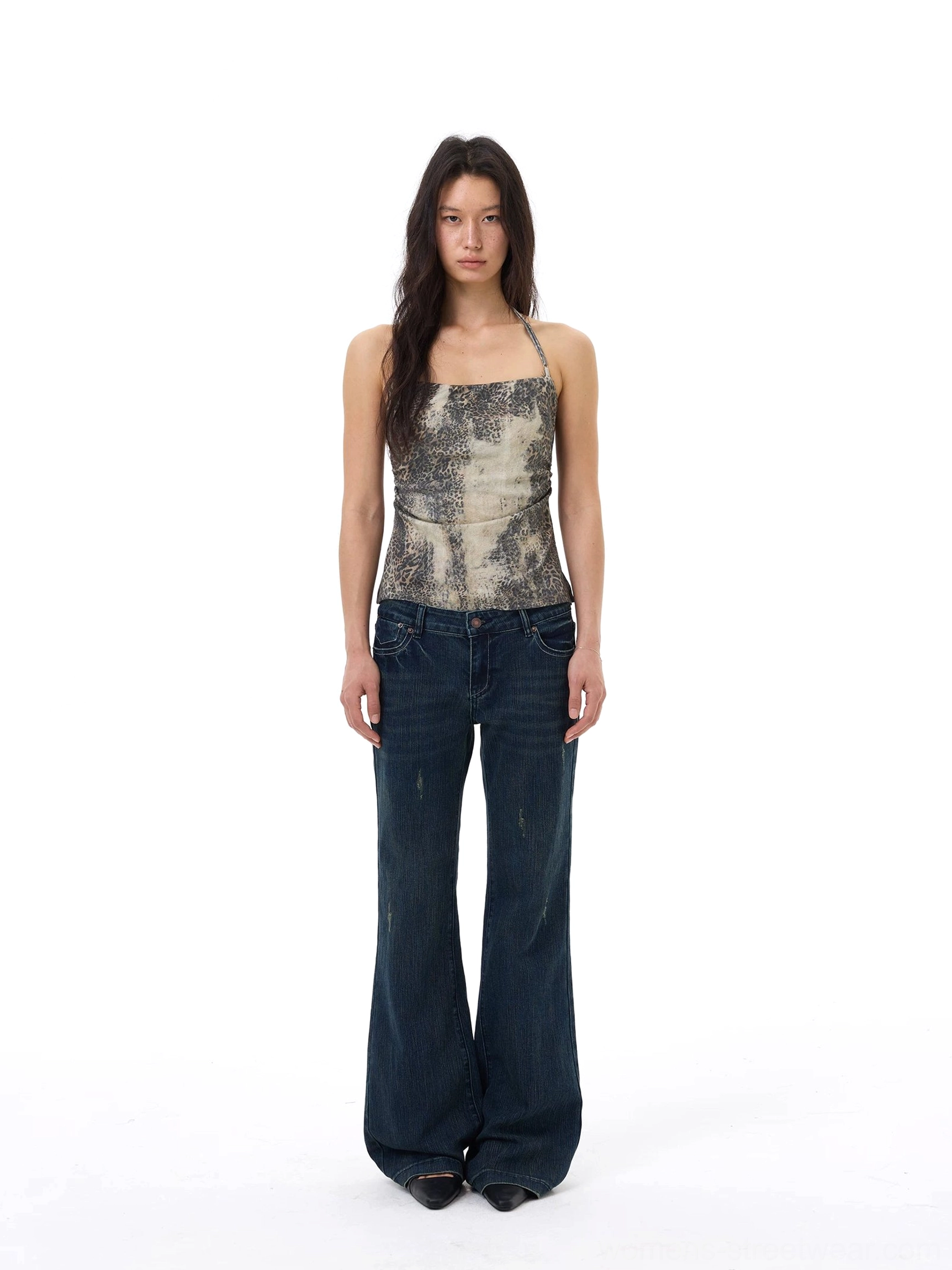 Full front view of a slim desert mirage print camisole top with square neckline and thin straps styled with blue wide-leg jeans