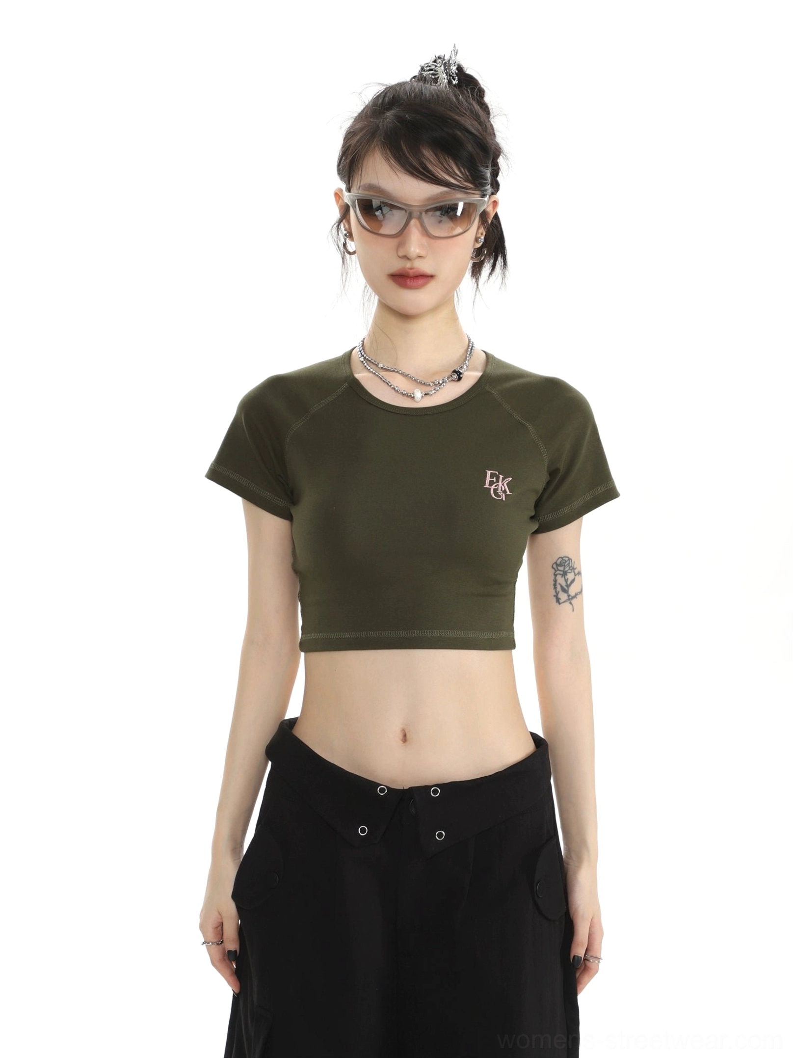 Close-up of army green fitted cropped baby tee with minimalist letter chest embroidery