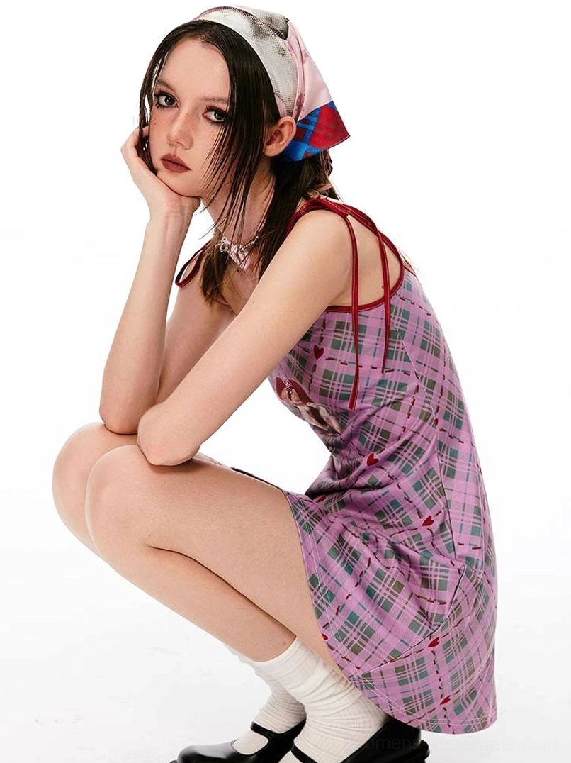 Y2K gingham mini dress with angel-inspired graphic print and playful red contrast styling
