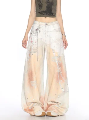 Front view of women wearing gradient chain print low-rise baggy wide-leg jeans with heart charm, rhinestone accents, and Y2K streetwear styling