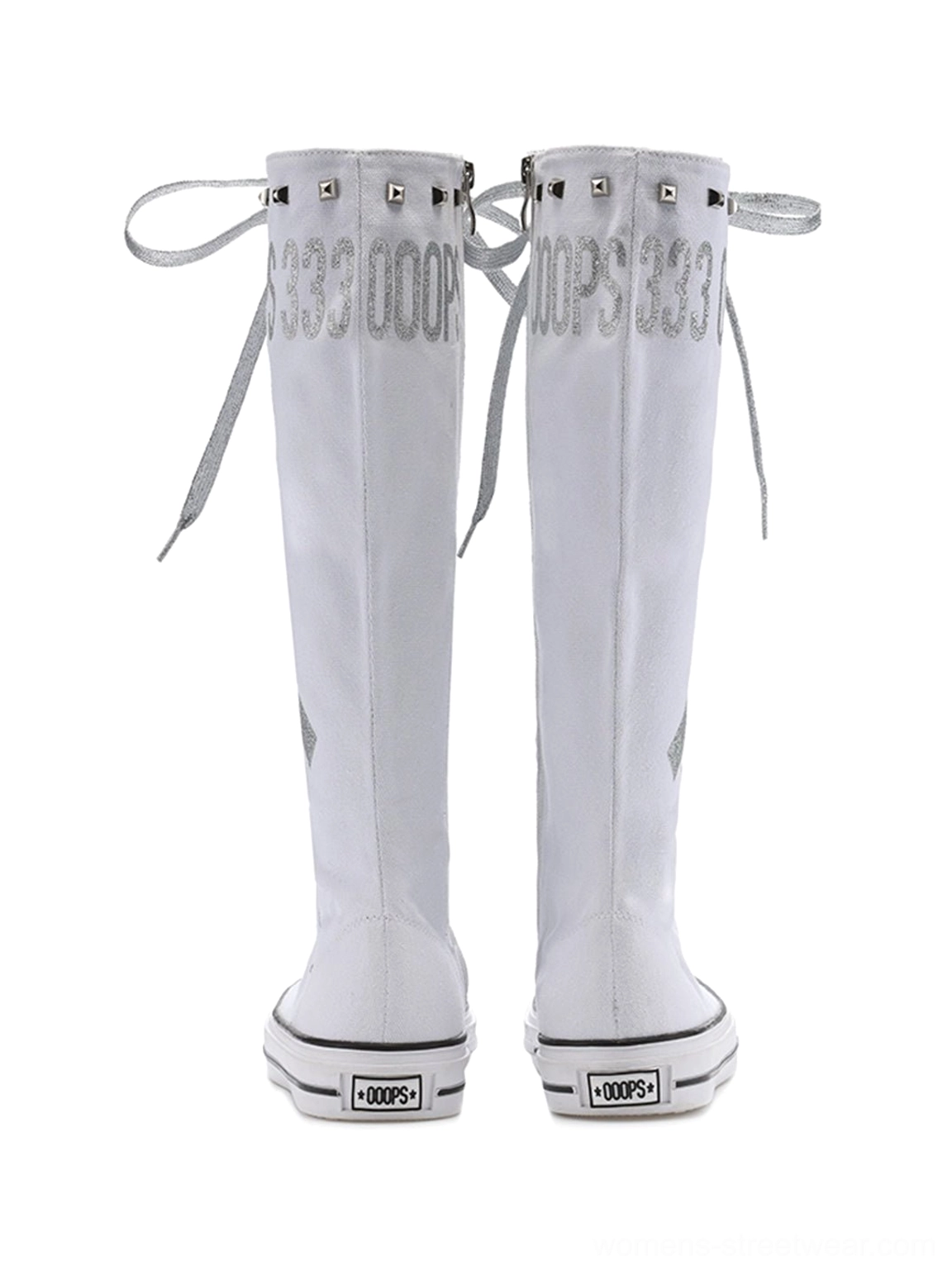 Y2K graphic canvas knee-high boots with studded collar trim, silver lace-up front, printed punk artwork, and flat rubber soles